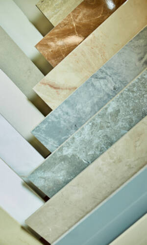 Various decorative tiles samples. Colorful samples of a stone tile in store. Copy space.